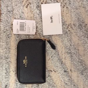 NWT. Coach black leather zip card case